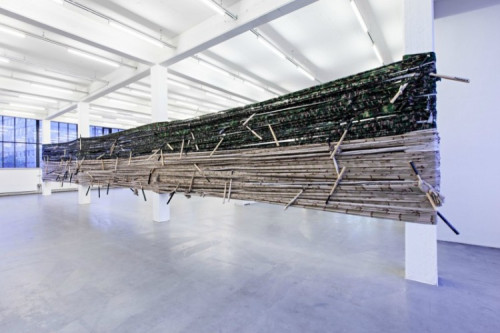 
     <i>Noch Fragen?</i>, 
     1998<br />
     camouflage material, baseball bats, 
      dimensions variable<br />
     Installation view Kunstverein Hamburg, Germany, 2013, Photo: Kunstverein Hamburg / Fred Dott