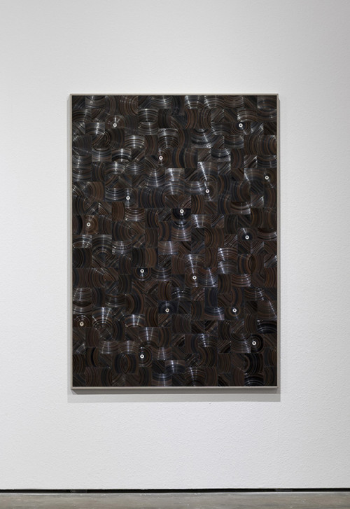 <i>In den Adern des Holzes seh ich Gesichter (Toco)</i>, 2018<br />cassette tape, cassette reels and canvas on wood, 179 x 127 cm<br />